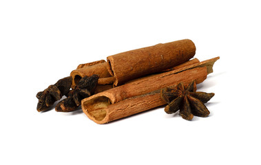 Whole cinnamon and corn snake isolated on white background. Spices for tea and mulled wine