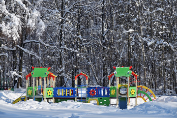 Naklejka premium Empty kids playground in winter city park