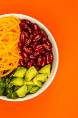 Vegan or Vegetarian Food Bowl With Kidney Beans Carrots Avocado and Watercress Salad