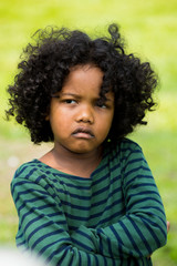 Portrait of little boy feeling sad and boring face