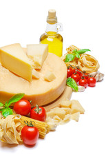 Traditional Italian parmesan or parmigiano cheese, pasta, tomatoes and olive oil