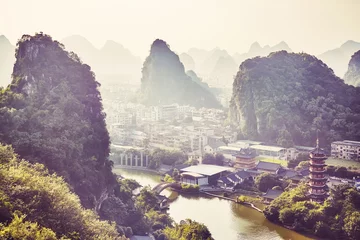Foto op Canvas Scenic sunset over Karst mountains formations in Guilin, color toned picture. © MaciejBledowski
