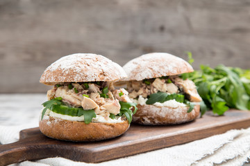 Food burger with tuna, herbs, cucumbers, cottage cheese, onions