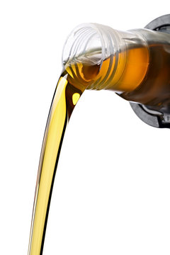 Pouring synthetic oils for car engine on a white background.