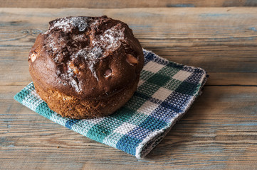 cake with raisins and dried fruits on a wooden table