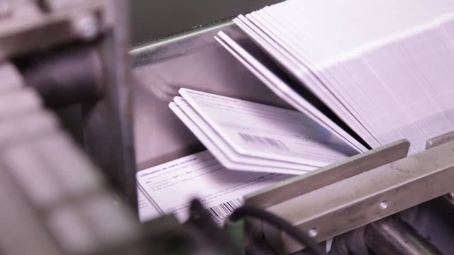 Printed cards on conveyor