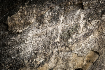 People and animals carved on rock, petroglyphs in Gobustan. Exposition of Petroglyphs in Gobustan...
