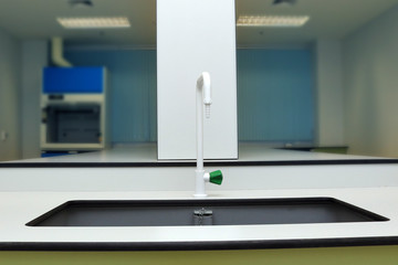 Sink and tap in chemical laboratory of science classroom.