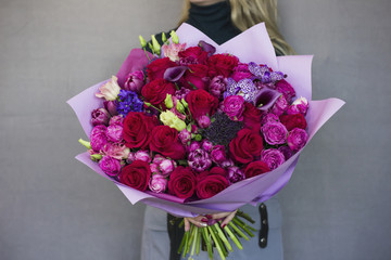 The big elegant bouquet of flowers in rustic style in woman hands