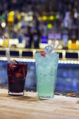 Two glasses with cocktail on the bar counter