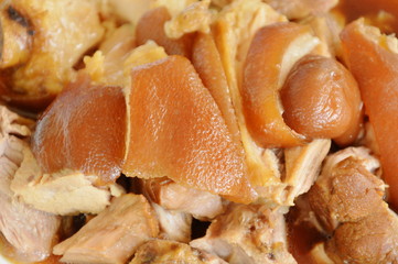 braised pork leg with black Chinese herb soup slice on plate