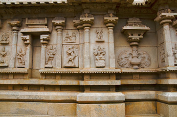 Carving details on the outer wall of Hazara Rama Temple. Hampi, Karnataka, India.