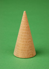 wooden geometric shapes on a green background