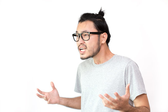 Closeup portrait of angry asian man screaming, isolated on white background with copy space