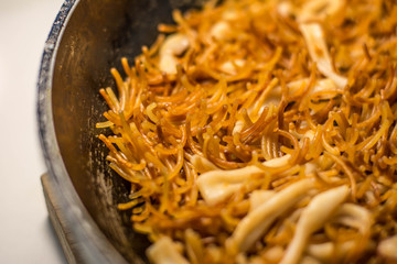 Spanish fideua, a typical noodles casserole, the noodle paella, with seafood, traditional Fideua from Spain.