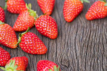 close up of strawberry on wooden background