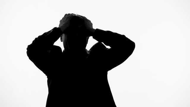 Man silhouette shouting in pain after loss of wife, becomes insane schizophrenia