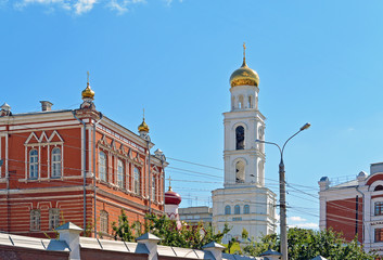 Fototapeta na wymiar Travel showplace - Iversky Women's Monastery in Samara in sunny summer day, blue sky. Classic russian ortodox religion architecture