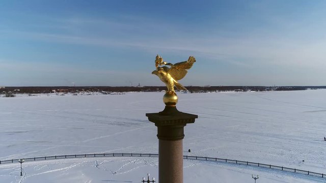 View from a height on the stele with an eagle in honor of the millennium of the city of Yaroslavl. Russia, winter.