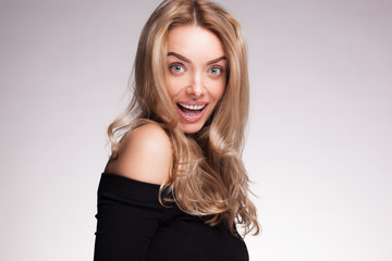 closeup portrait of beautyful blond surprised woman with clean fresh skin