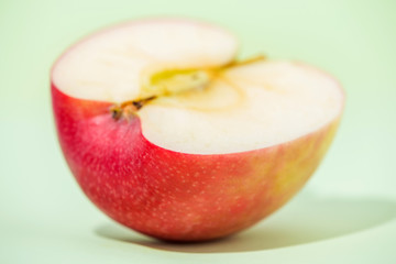 sliced apple fruit isolated on green blackground, pop art color concept