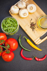 cooking ingredients on a black stone background