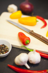 cooking ingredients on a black stone background