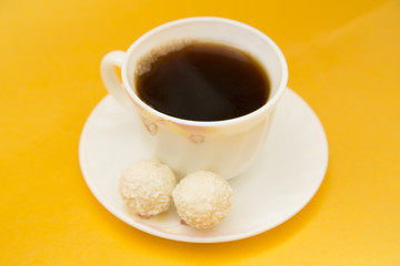 Coffee on yellow background