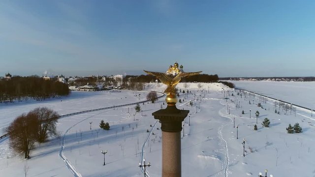 View from a height on the stele with an eagle in honor of the millennium of the city of Yaroslavl. Russia, winter.