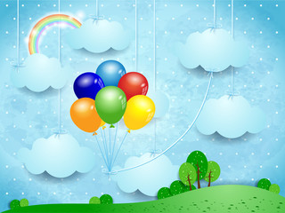 Surreal landscape with hanging clouds and balloons