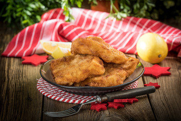 Fried cod slices in breadcrumbs.