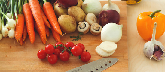 Pile of organic vegetables on a wooden table