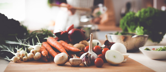Young Woman Cooking in the kitchen. Healthy Food