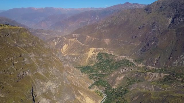 Aerial tilting down bird's eye view of the Colca Canyon Valley in Peru