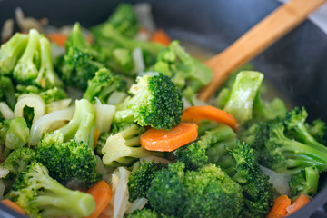 Fresh cabbage broccoli stewed with vegetables in a frying pan