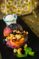 Grilled peaches with nuts and ice-cream