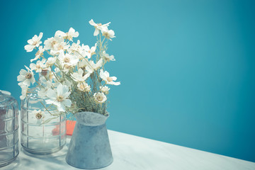Retro home decor, flowers and on a wall shelf