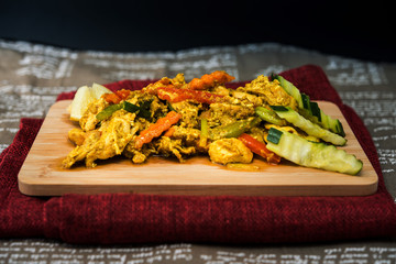 wok fried chicken stir fry with sweet peppers and chinese vegetables