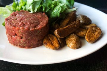 tasty Steak tartare (Raw beef) - classic steak tartare on white plate