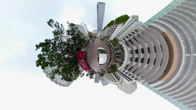 Tiny planet driving through a city