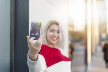 Self portrait of beautiful young blonde woman