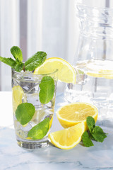 Glass of water with lemon and mint