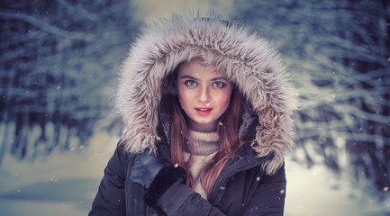 Portrait of a beautiful girl dressed for winter. Beautiful features, nice face