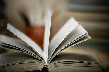 Textbooks and books on a wooden table