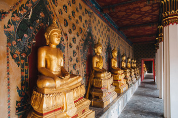ancient golden buddha statues in Bangkok, Thailand