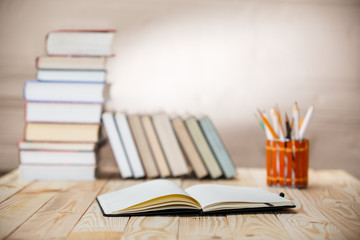 Textbooks and books on a wooden table