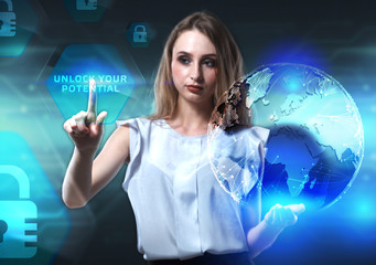 The concept of business, technology, the Internet and the network. A young entrepreneur working on a virtual screen of the future and sees the inscription: Unlock your potential