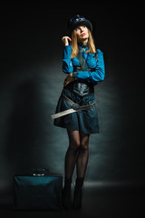 Steampunk girl with retro bag.