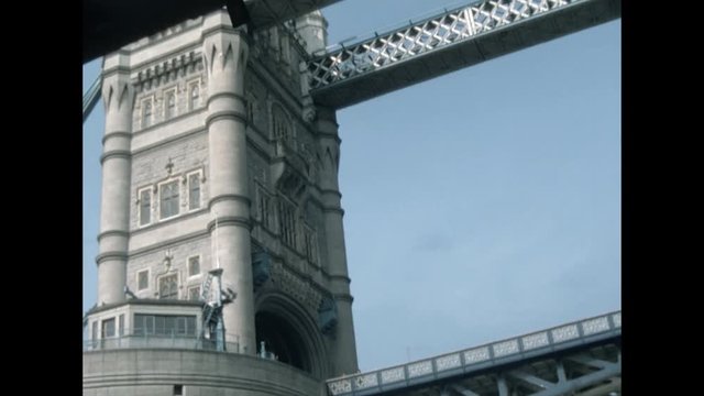 London, United Kingdom - 1978: Navigation of the river Thames, the Tower of London and Tower Bridge. 