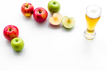 Apple cider poured into glass. White background top view copy space